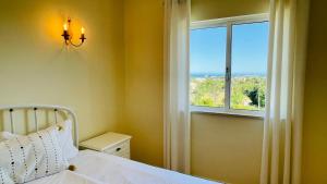 a bedroom with a bed and a window at Lara Lima by Check-in Portugal in Albufeira