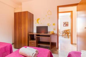TV a/nebo společenská místnost v ubytování Casa Riviera