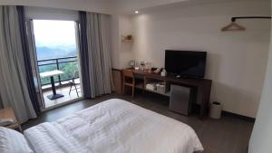 TV/Unterhaltungsangebot in der Unterkunft One Roll Stone Homestay