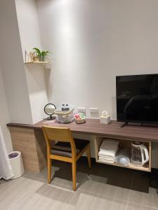 TV/Unterhaltungsangebot in der Unterkunft One Roll Stone Homestay