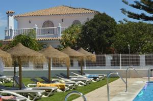 Bazén v ubytování Hostal El Capi nebo v jeho okolí