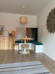 a dining room with a table and two chairs at mieszkanko_karkonoska in Jelenia Góra