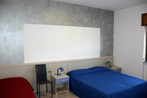 Voodi või voodid majutusasutuse Lucantò Accommodations toas