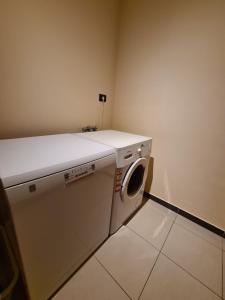 a laundry room with a washing machine in it at Apartman Luka in Pula