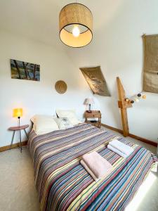 Voodi või voodid majutusasutuse Maison de vacances tout confort - 500m des plages toas