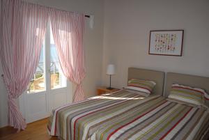 Postel nebo postele na pokoji v ubytování Ioli's Villas