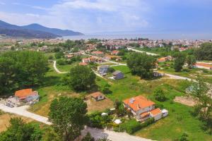 an aerial view of a village with houses and trees at Angel Villa - Thassos Town in Limenas