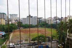 a view of a park in a city with buildings at CITY HOMES ORCHID APARTMENT in Mumbai