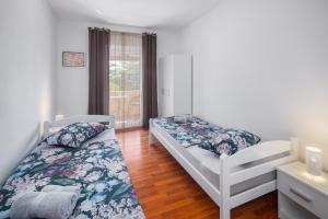 Posteľ alebo postele v izbe v ubytovaní Casa Viktoria with private garden and BBQ