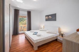 Posteľ alebo postele v izbe v ubytovaní Casa Viktoria with private garden and BBQ