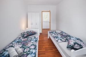 Posteľ alebo postele v izbe v ubytovaní Casa Viktoria with private garden and BBQ