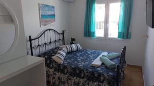 Cama ou camas em um quarto em Sausan Hotel