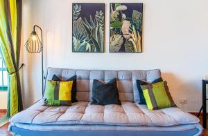 A bed or beds in a room at Las Vistas Ocean View PH08