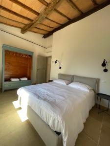 Katil atau katil-katil dalam bilik di Maremma Country Chic (il Gelsomino)