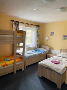 A bed or beds in a room at Hotel Sonnenhof/Slavia