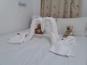 A bed or beds in a room at San Georgio Hotel