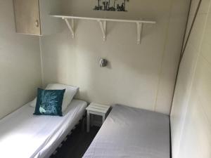 Posteľ alebo postele v izbe v ubytovaní Gîte Panda house