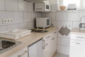 Kuhinja oz. manjša kuhinja v nastanitvi Ferienwohnungen Rijawetz