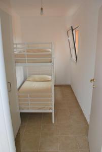 Postel nebo postele na pokoji v ubytování Residence Conca Blue