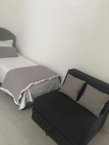 Posteľ alebo postele v izbe v ubytovaní Perla Luxury Apartment