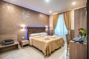 Uma cama ou camas num quarto em Hotel Centro Cavour Roma
