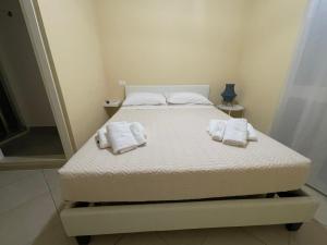 Postel nebo postele na pokoji v ubytování Minioto Rooms