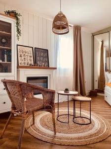 a living room with a chair and a table at La Casita del Patio in Santiago de Compostela