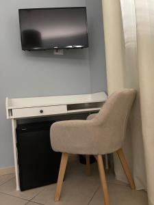 TV a/nebo společenská místnost v ubytování Minioto Rooms