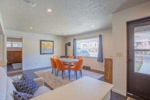 a living room with a table and chairs at Spacious 4 bedroom house close to everything! in Salida