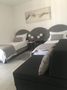 Posteľ alebo postele v izbe v ubytovaní Perla Luxury Apartment