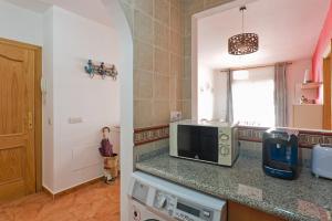Kuchyň nebo kuchyňský kout v ubytování Relaxing Beach Apartment in Fuengirola Parking