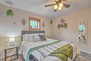 a bedroom with a bed and a ceiling fan at Pet-Friendly Waynesville Home with Mountain Views! in Waynesville