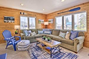 a living room with a couch and a table at Walk to Water Grand Lake Home with Hot Tub! in Grand Lake