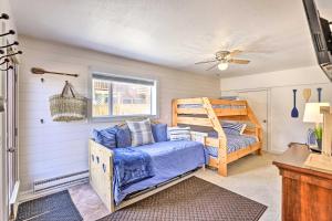 a bedroom with a bunk bed and a crib at Walk to Water Grand Lake Home with Hot Tub! in Grand Lake