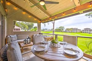 a dining room with a table and chairs on a patio at Chic Waikoloa Condo with Lanai and Complex Pools! in Waikoloa