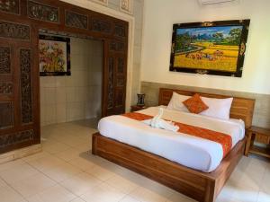Postel nebo postele na pokoji v ubytování Uma Loris Ubud