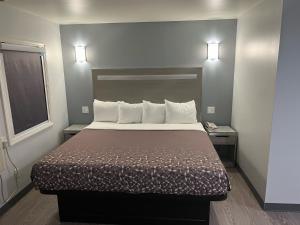 Postel nebo postele na pokoji v ubytování 112 Motel