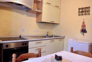 a kitchen with a sink and a stove at Petit-Antey 38 in Antey-Saint-André