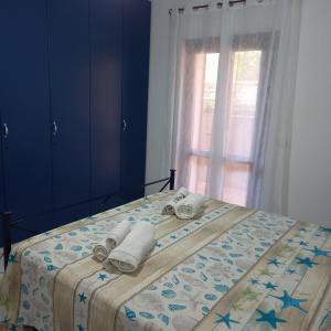 מיטה או מיטות בחדר ב-Casa Debby