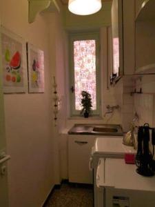 a kitchen with a sink and a window at Classic Monterossino Apartment in Old Town in Monterosso al Mare