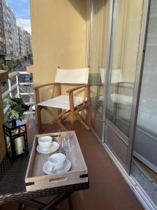 a balcony with a table and a chair on a balcony at Vut Salvador Santiago in Santiago de Compostela
