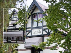 a house with a black and white facade at Zenzez Hotel & Lounge in Apeldoorn
