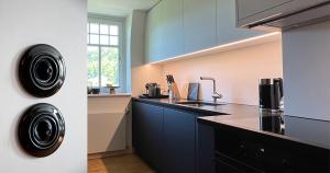 Kuchyň nebo kuchyňský kout v ubytování Boutique Apartments Bezau