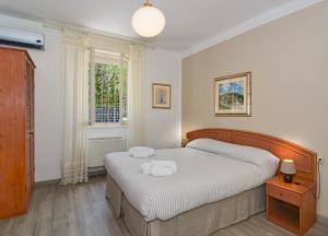 Postel nebo postele na pokoji v ubytování Hotel Ambra