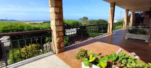 a balcony with a view of the ocean at Apartamento Tomela in Noja