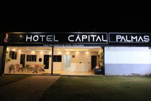 a hotel pavilion at night with a sign on it at HOTEL CAPITAL PALMAS in Palmas