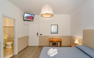Postel nebo postele na pokoji v ubytování Hotel Ambra