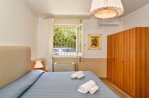 Postel nebo postele na pokoji v ubytování Hotel Ambra