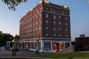 a large brick building on a city street at Landmark Inn in Marquette