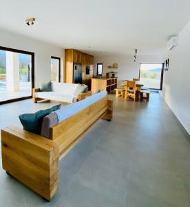 a large living room with a couch and a table at Villa Fluggi near Labin in Santalezi